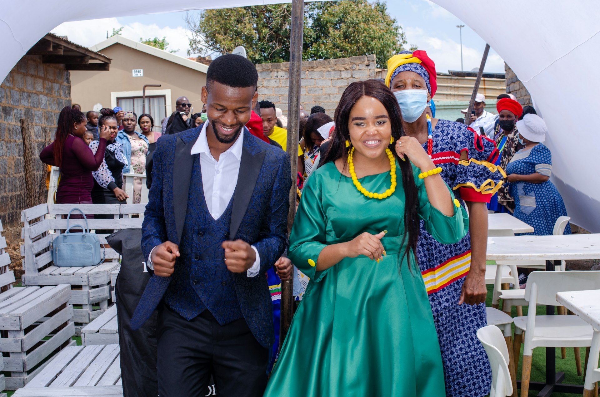 a man and a woman walking under an umbrella